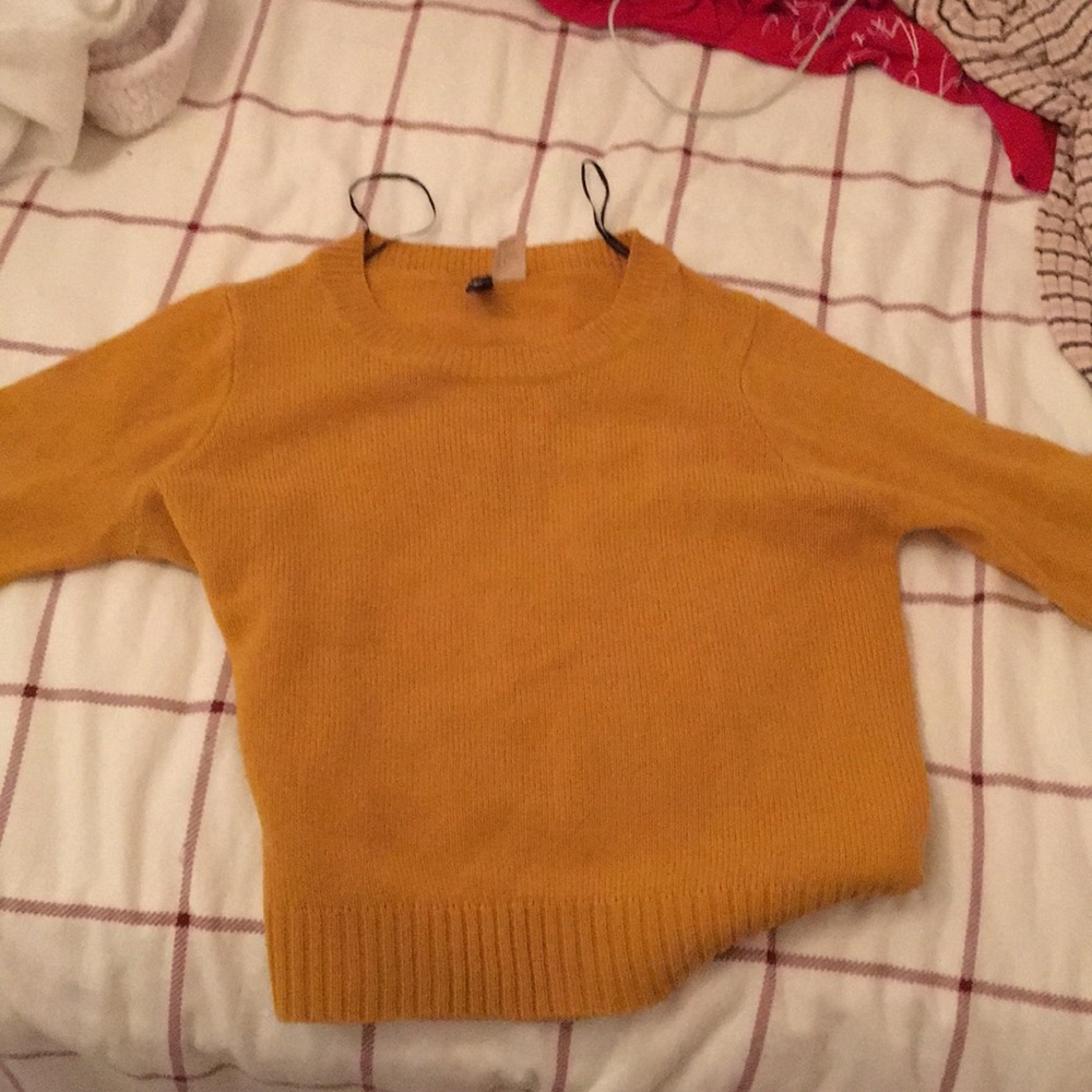 gold sweater
